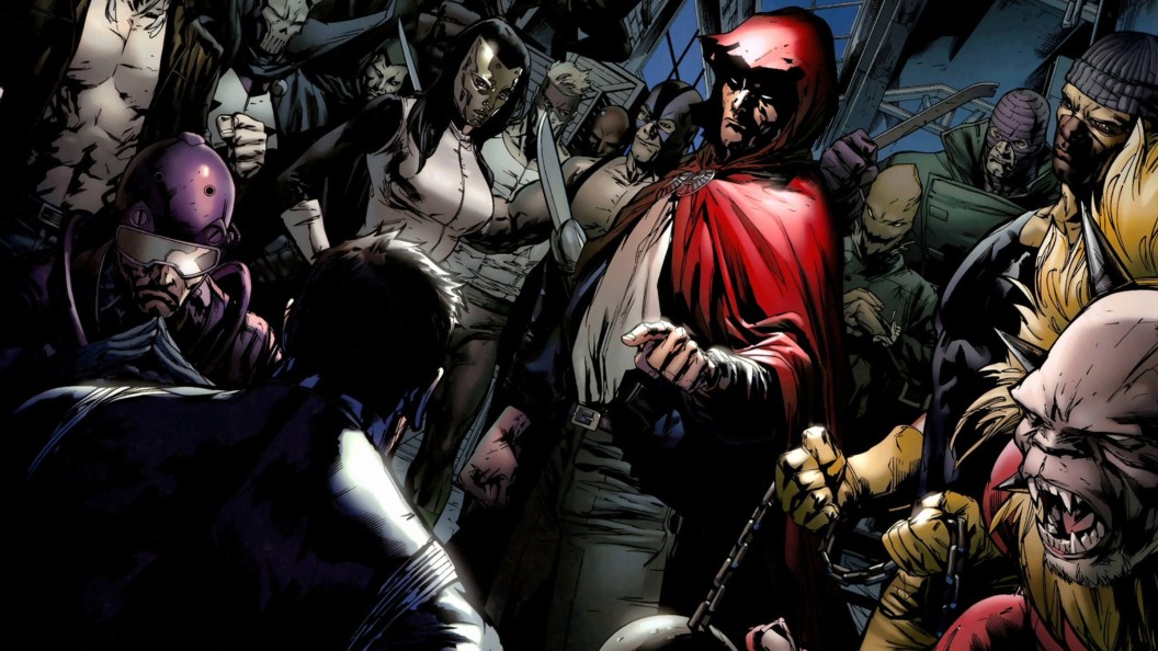 The Hood standing with his gang talking to an enemy in shadow