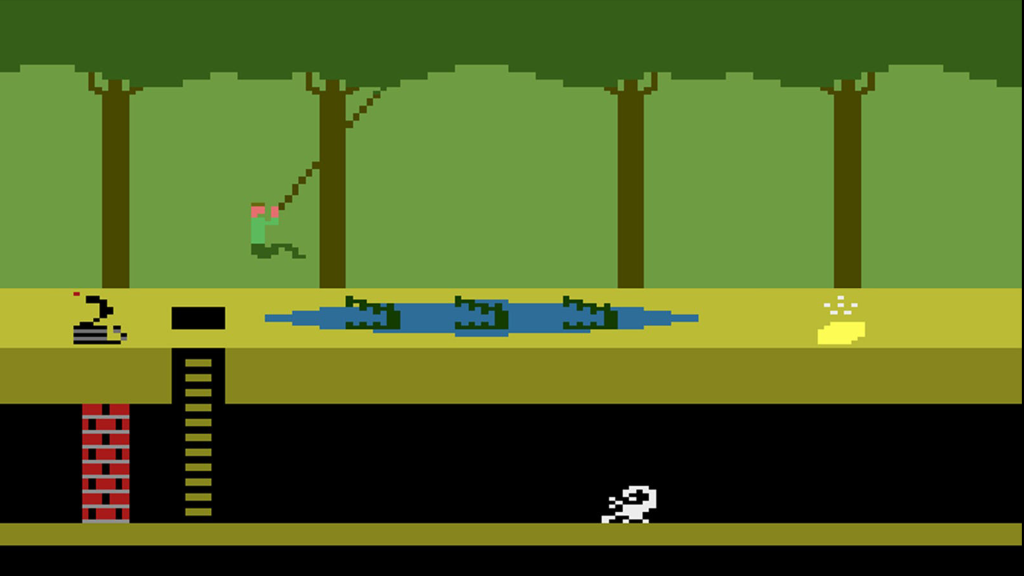 A screenshot of Pitfall! on the Atari 2600, showing the player swinging from a vine over a pool of crocodiles.