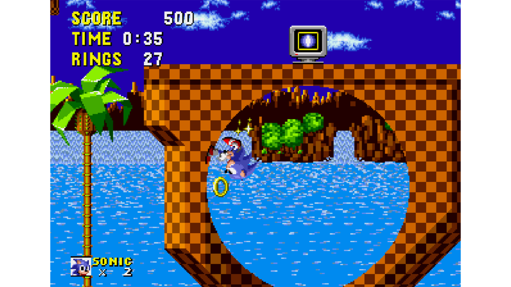 A screenshot from Sonic the Hedgehog, showing Sonic running through a loop.