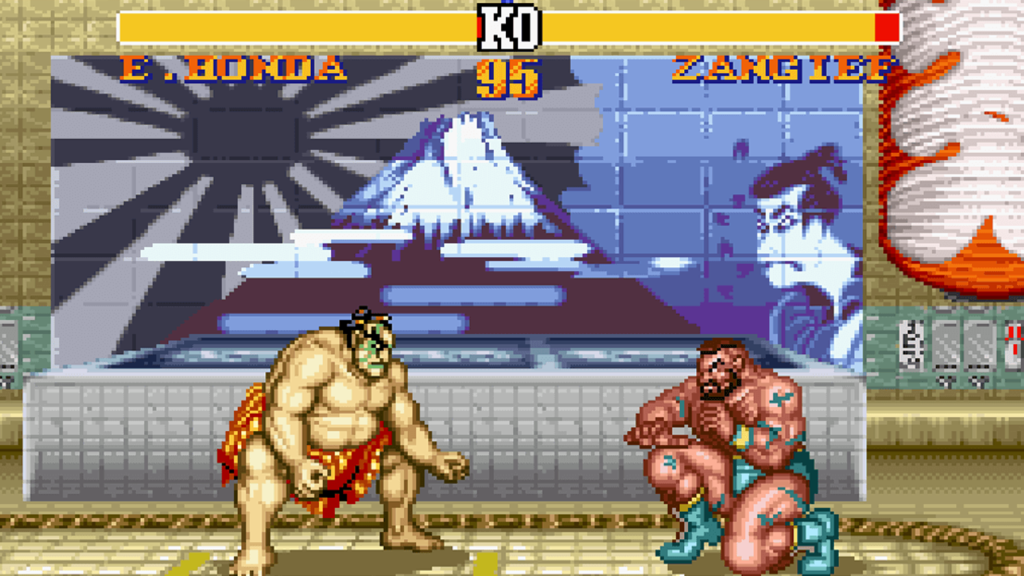 A screenshot from the Super Nintendo port of Street Fighter II Turbo, showing Honda and Zangief preparing to fight.