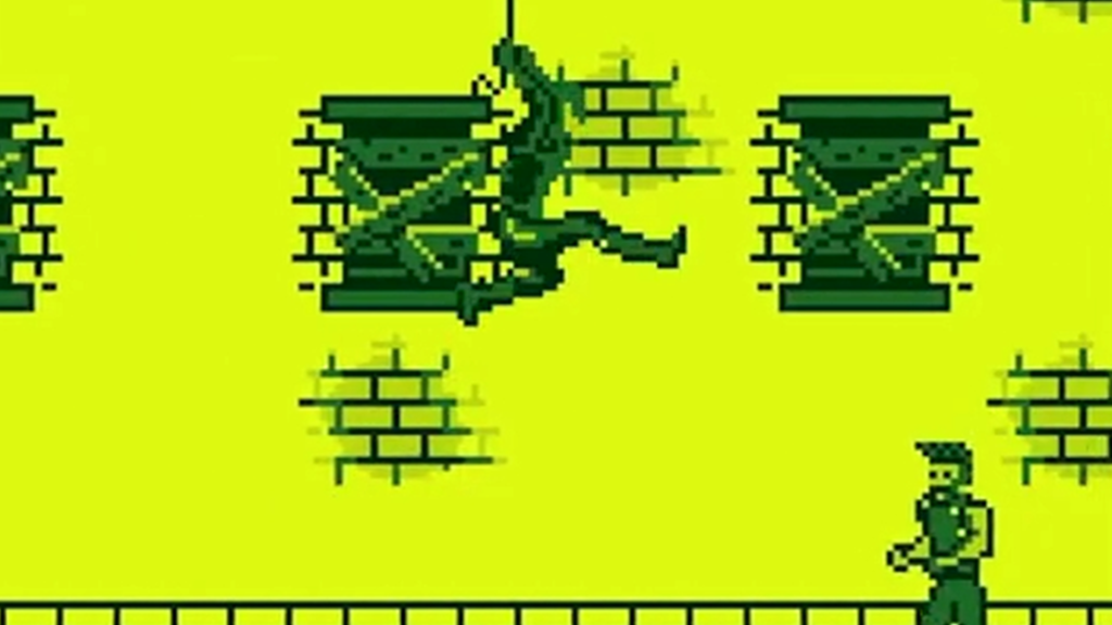 The Amazing Spider-Man on the Game Boy, showing Spider-Man swinging over an enemy in front of a dilapidated building.