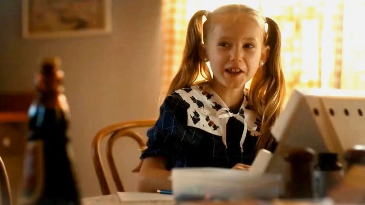 Holly Wheeler sitting at the table in Stranger Things