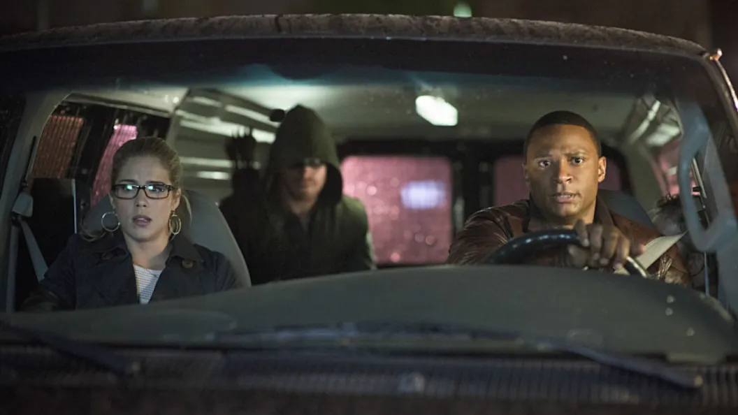 Diggle, Oliver, and Felicity in a truck in Arrow.