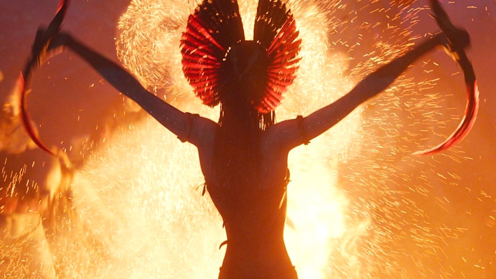 Varang holding blades and facing away in Avatar: Fire and Ash