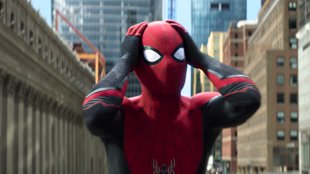 Tom Holland as Spider-Man clutching his head in Spider-Man: Far From Home (2019)