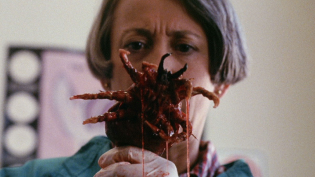 A woman inspecting a creature in Ticks (1993)
