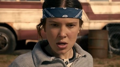 Millie Bobby Brown as Eleven training with a bandana on her head in Stranger Things Season 5