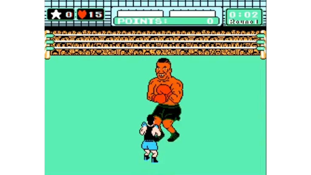 A screenshot from Mike Tyson’s Punch-Out!, showing Little Mac fighting Mike Tyson.