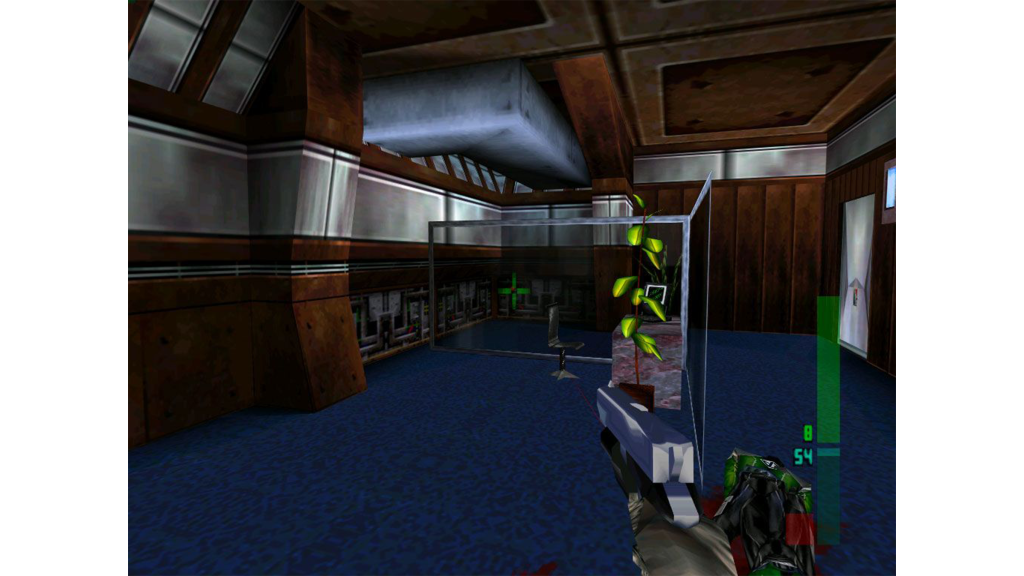 A screenshot from Perfect Dark, showing the player wielding a pistol.