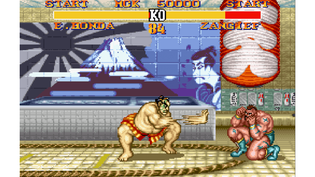 A screenshot from Street Fighter II' Turbo: Hyper Fighting, showing a fight between E. Honda and Zangief.
