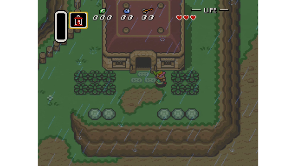 A screenshot from The Legend of Zelda: A Link to the Past, showing Link walking by a house in the rain.