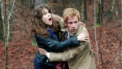 Constantine holding up a woman.