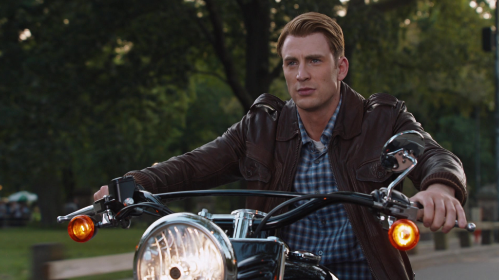 Chris Evans as Steve Rogers riding a motorcycle in The Avengers (2012)