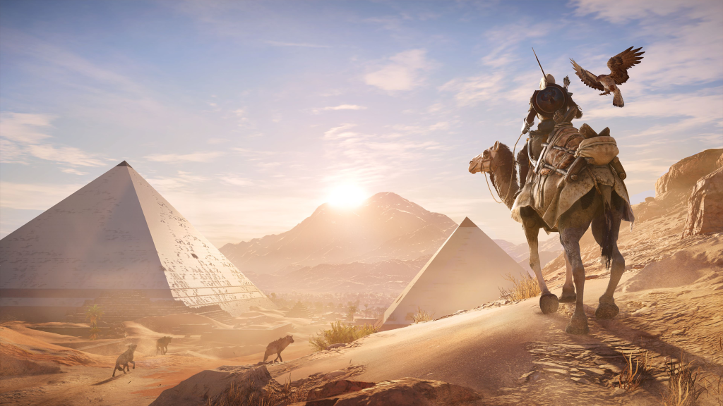 A screenshot from Assassin’s Creed Origins, showing a man on a camel overlooking the Great Pyramids.