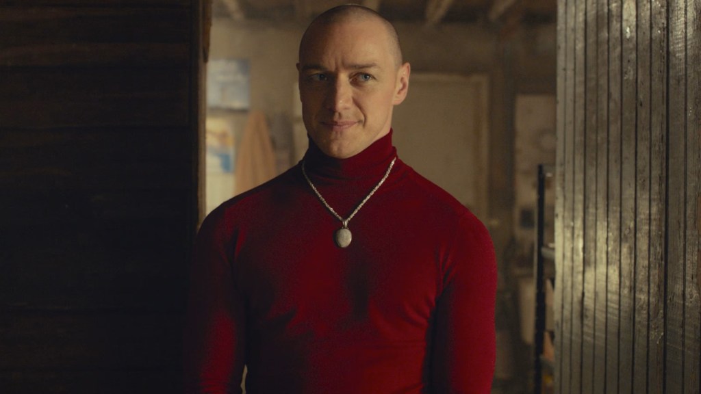 James McAvoy as Kevin wearing a red turtleneck sweater in Split