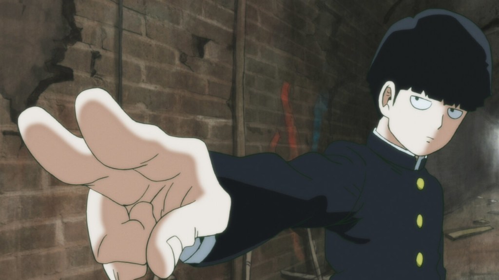 Shigeo holding out his hand while in his school uniform in Mob Psycho 100