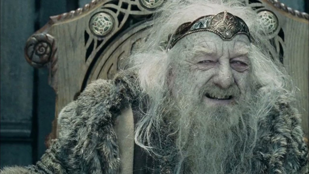 Theoden laughing at Gandalf from his throne in The Lord of the Rings: The Two Towers
