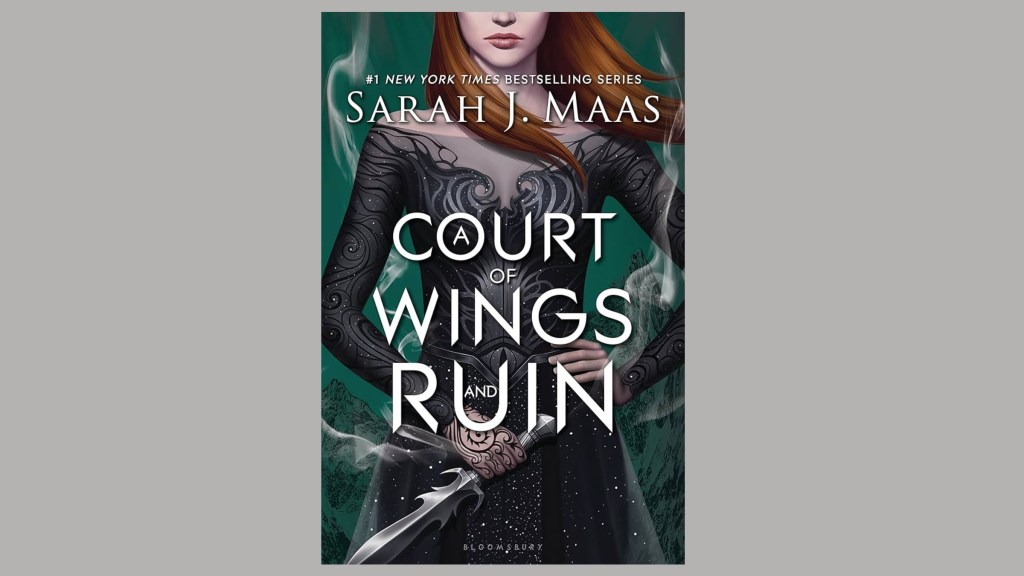 The cover of A Court of Wings & Ruin against a gray background