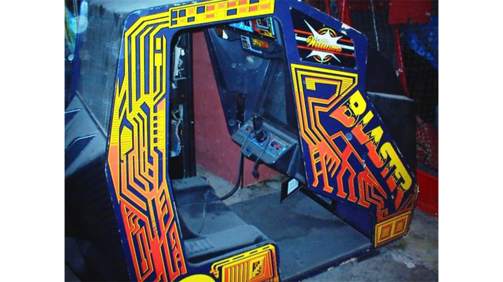 An old, worn down Blaster cockpit arcade cabinet.
