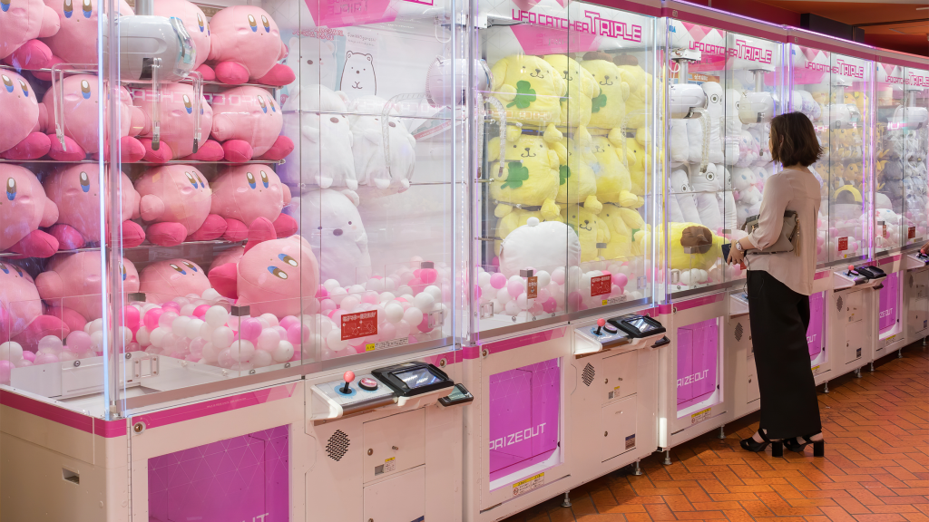 A row of UFO Catcher claw machines in Tokyo