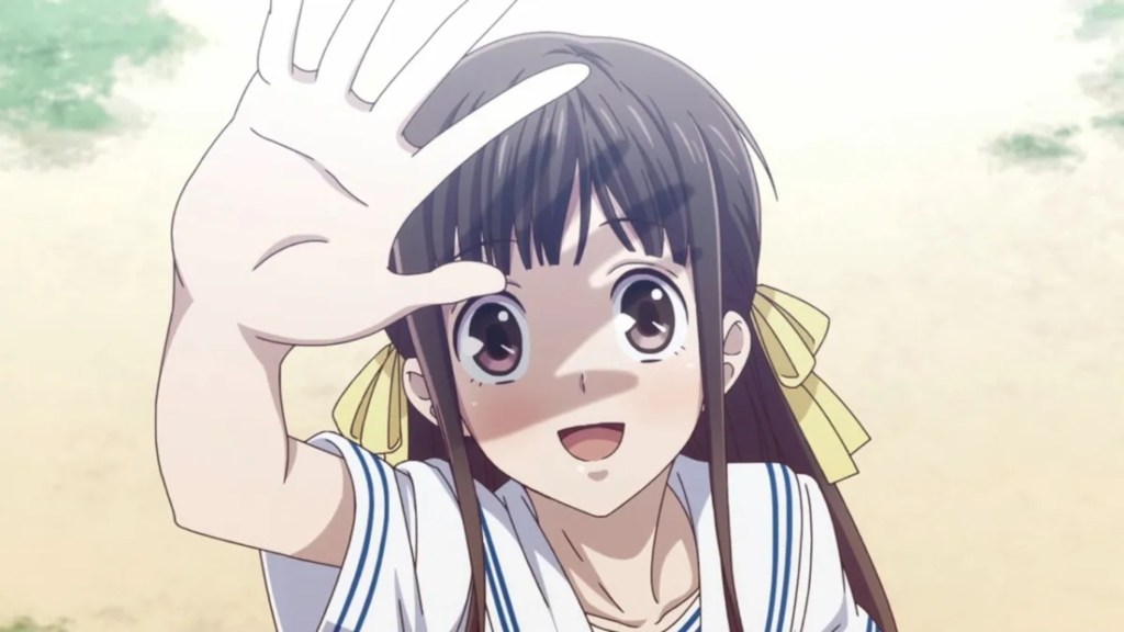 Tohru Honda holding up a hand and smiling in Fruits Basket (2019)