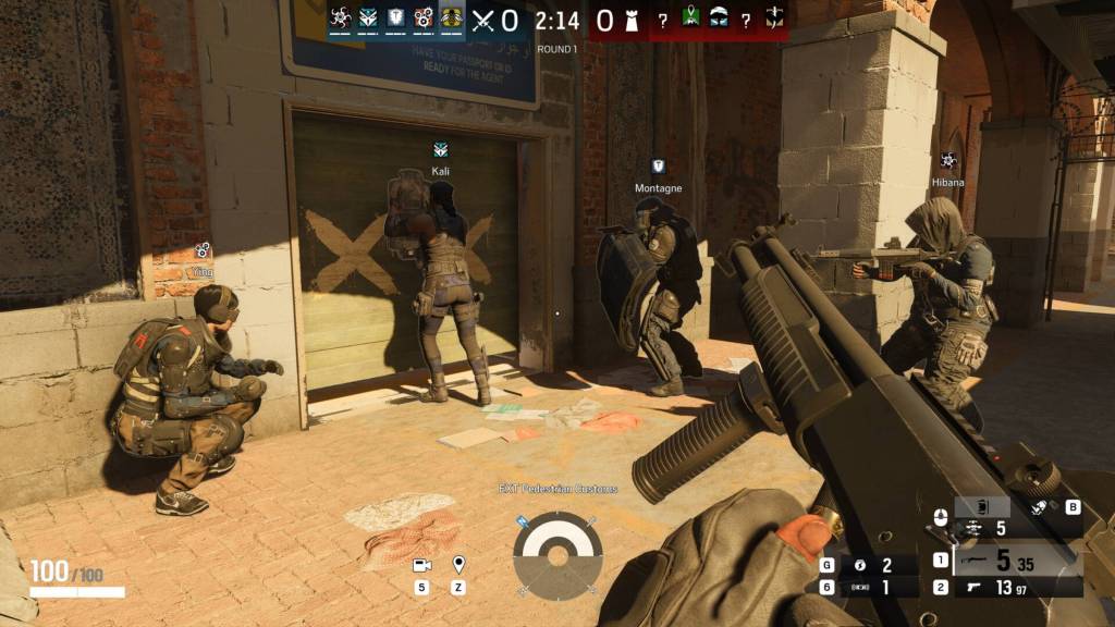 A group of soldiers standing outside of a building in Rainbow Six Siege.