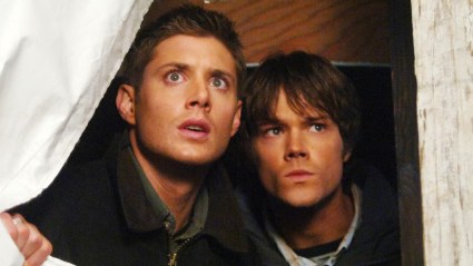 Sam and Dean Winchester in Supernatural looking out a window.