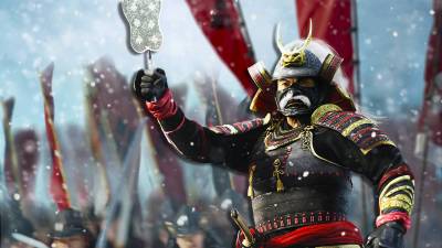 A shogun lifting up their fan in Shogun 2 Total War.