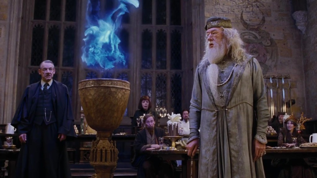 Dumbledore standing next to the Goblet of Fire