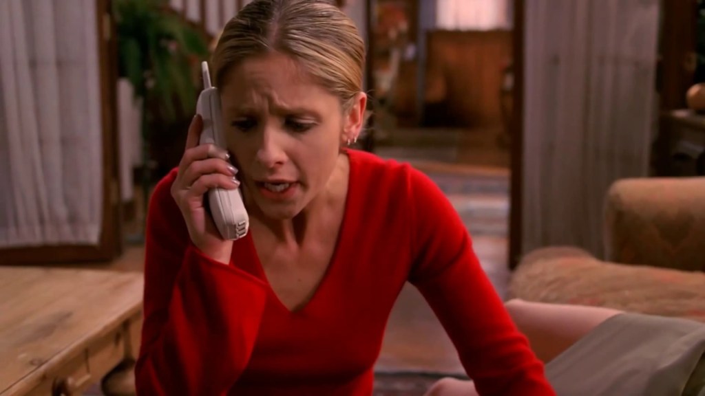 Buffy looking distraught on the phone in Buffy the Vampire Slayer