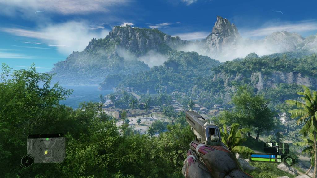 The player holding a pistol looking at a distant mountain in Crysis Remastered.