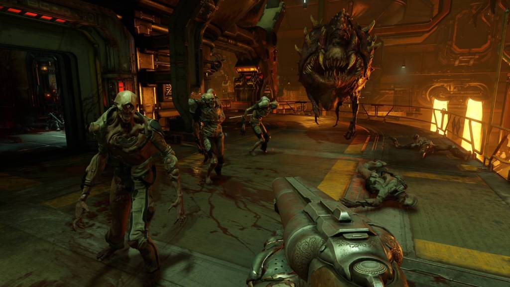 The player holding a shotgun in DOOM 2016
