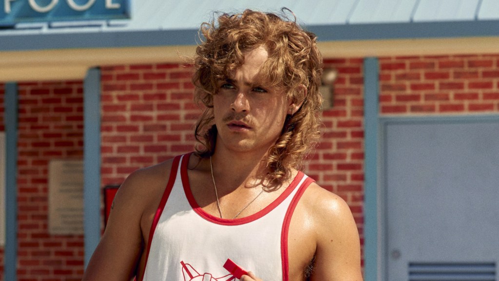 Dacre Montgomery as Billy Hargrove looking at something off-screen in Stranger Things