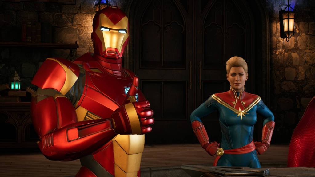 Homem de Ferro com o polegar para cima ao lado da Capitã Marvel em Marvel's Midnight Suns