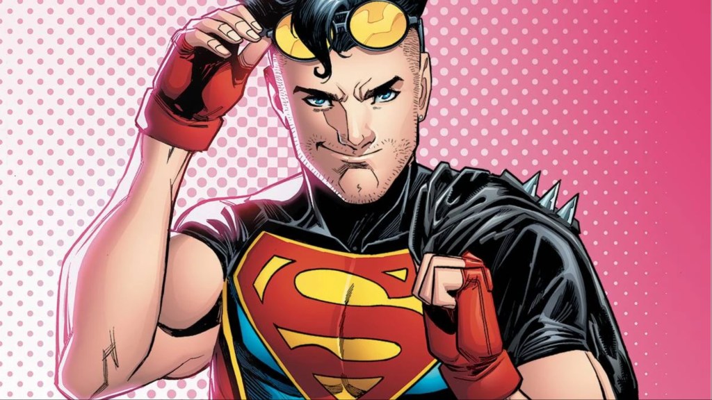 Conner Kent smirking and lifting his glasses