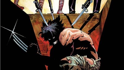 Wolverine with his claws out in a box in the ground with bayonets pointed at him