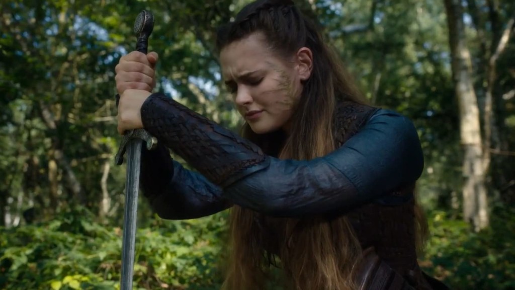 Nimue looking distressed while holding Excalibur in Netflix's Cursed