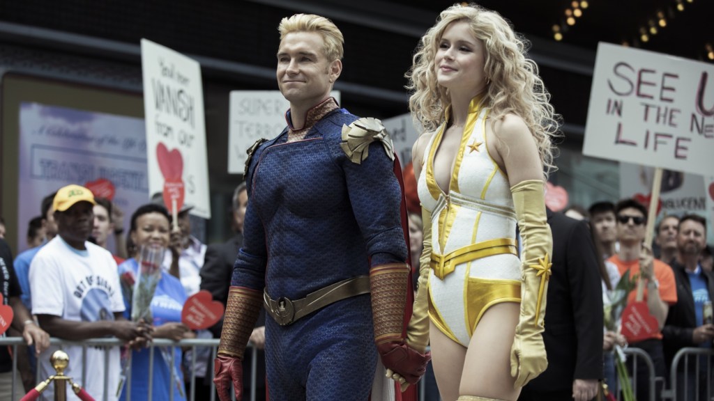 Homelander and Starlight standing in front of protestors in The Boys Season 2