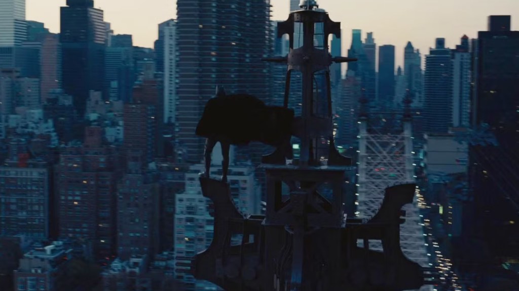 Batman standing over Gotham City in The Dark Knight