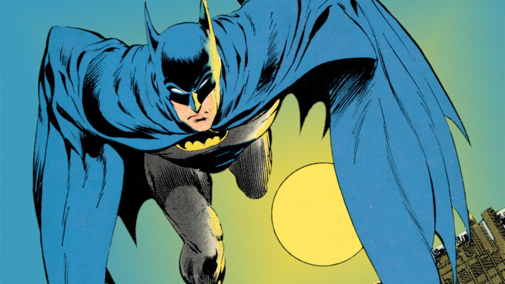 Batman runs at cover blue and black costume