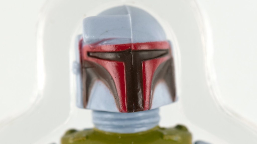 A close up of a Boba Fett action figure from 1979.