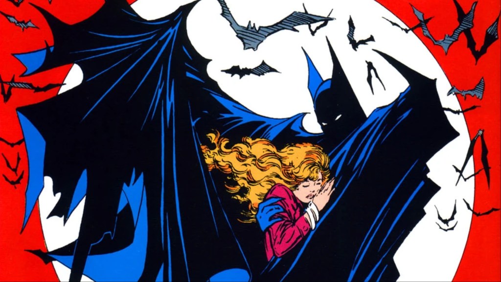 Batman holding a woman enfolded in his cape