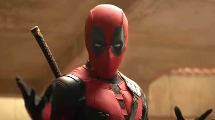 Deadpool looking at camera with hands raised
