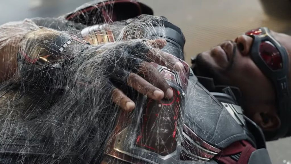 Falcon webbed to the ground by Spider-Man