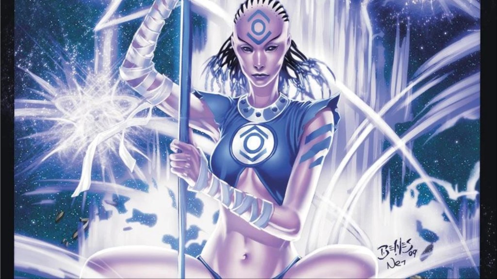 Indigo-1 sitting and holding her staff