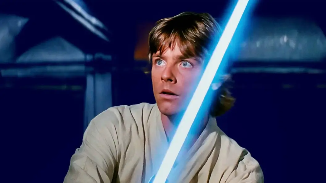 Luke Skywalker with his lightsaber in Star Wars: A New Hope.