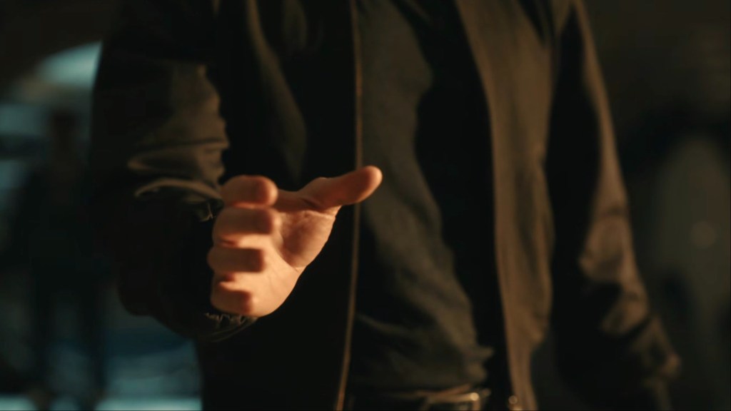Steve Rogers' hand with someone in the background