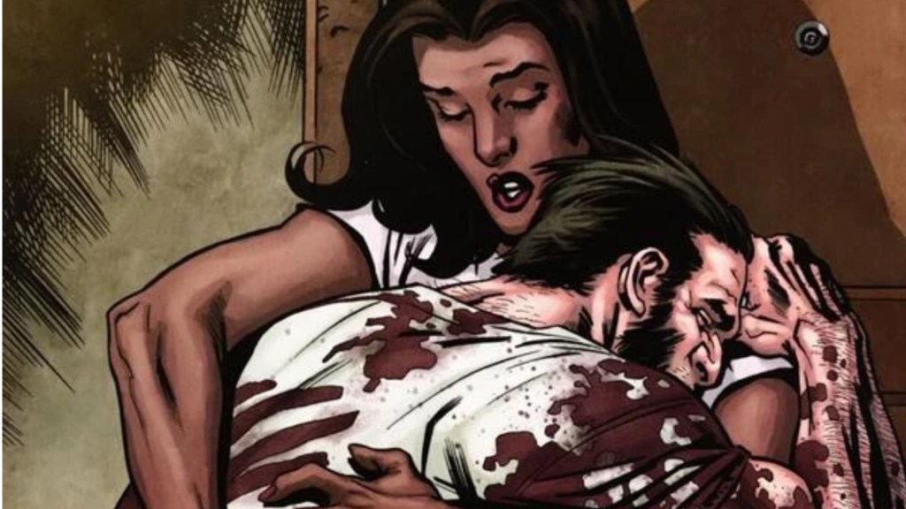 A bloody Logan hugging Melita Garner