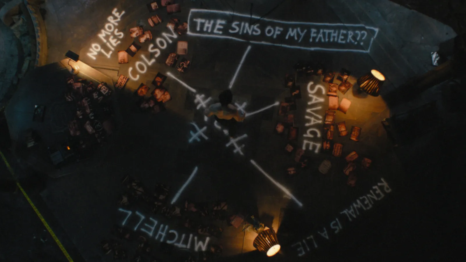 Bruce Wayne pieces together the clues left by The Riddler.
