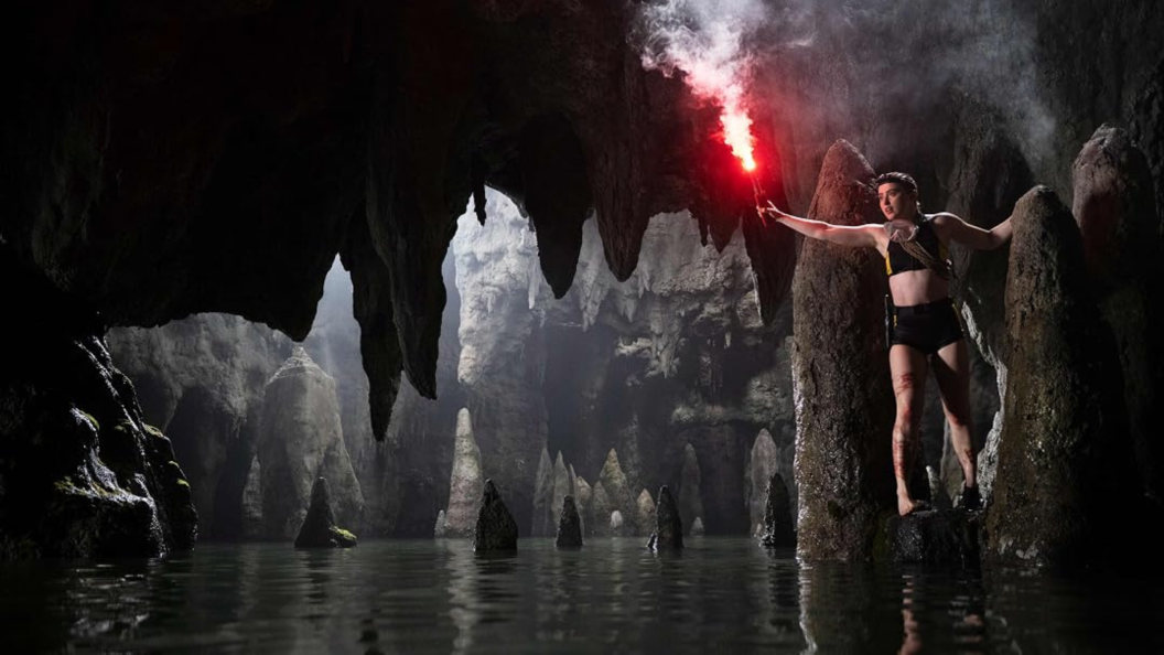 He-Man facing a shark in a perilous cave situation.